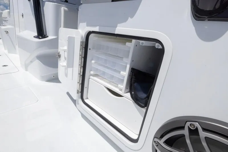  Yacht Photos Pics Storage compartment on 2026 Invincible 36 Catamaran, featuring organized shelves and sleek design.
