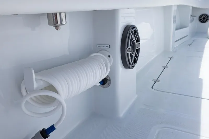  Yacht Photos Pics 2026 Invincible 36 Catamaran deck with coiled hose and speaker detail.