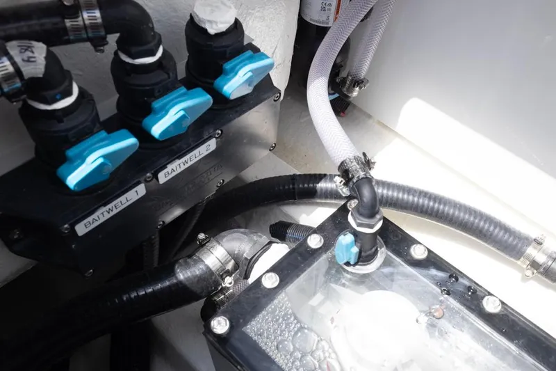  Yacht Photos Pics Baitwell system in 2026 Invincible 36 Catamaran, featuring labeled valves and hoses.