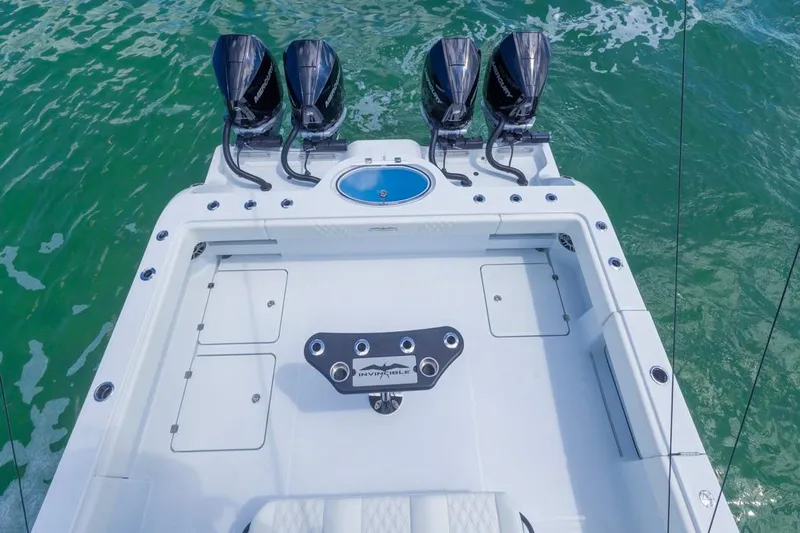  Yacht Photos Pics 2026 Invincible 36 Catamaran with four powerful engines on turquoise water.