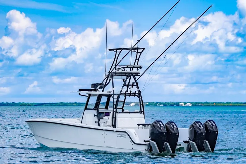  Yacht Photos Pics 2026 Invincible 36 Catamaran on open water, featuring multiple outboard engines.
