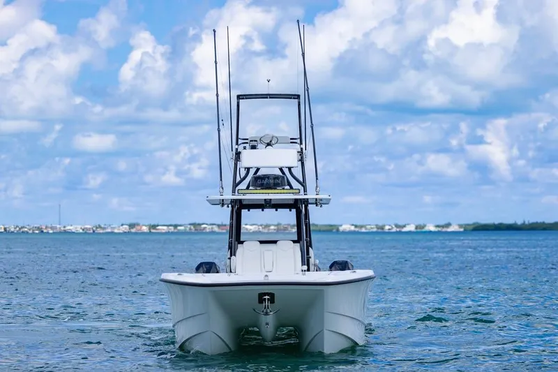  Yacht Photos Pics 2026 Invincible 36 Catamaran on open water under a cloudy sky.