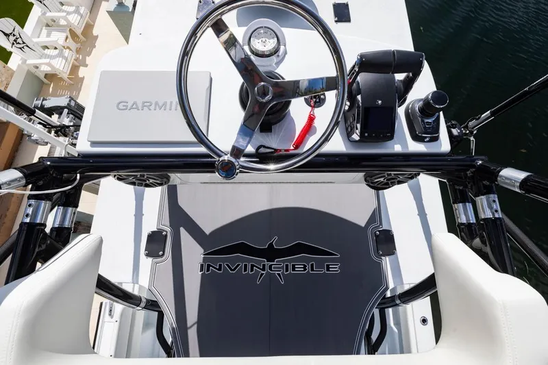  Yacht Photos Pics 2026 Invincible 36 Catamaran helm with Garmin navigation and sleek design.