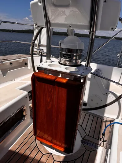 Dawn Treader Yacht Photos Pics Tartan 3700 Keel/Centerboard sailboat cockpit with wooden table and compass, 2005 model.