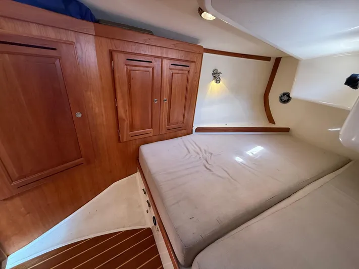 Dawn Treader Yacht Photos Pics Cozy cabin interior of 2005 Tartan 3700 Keel/Centerboard sailboat with wooden cabinetry.