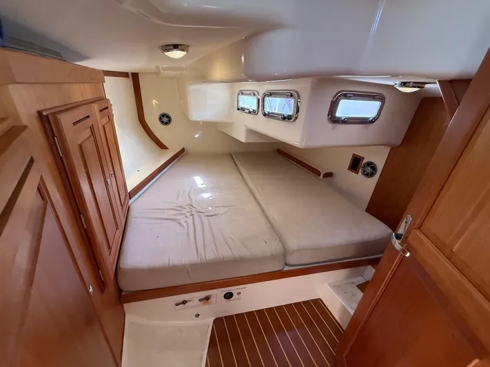 Dawn Treader Yacht Photos Pics Interior cabin of 2005 Tartan 3700 Keel/Centerboard sailboat with wooden finishes.