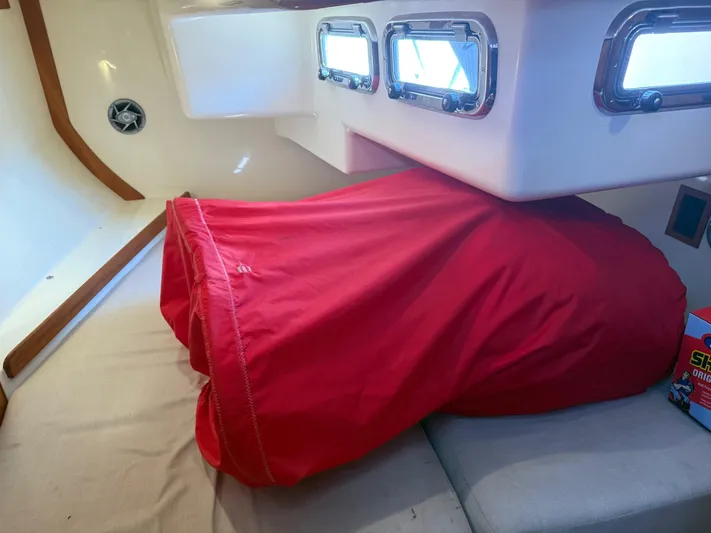 Dawn Treader Yacht Photos Pics Interior of 2005 Tartan 3700 Keel/Centerboard with red cover and portholes.