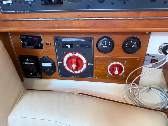 Dawn Treader Yacht Photos Pics Control panel of a 2005 Tartan 3700 Keel/Centerboard sailboat with switches and gauges.