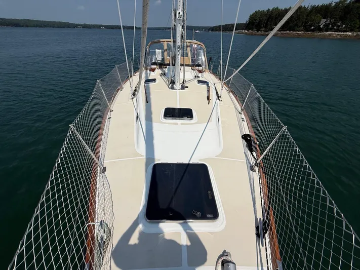 Dawn Treader Yacht Photos Pics Tartan 3700 Keel/Centerboard sailboat deck, 2005 model, on calm water.