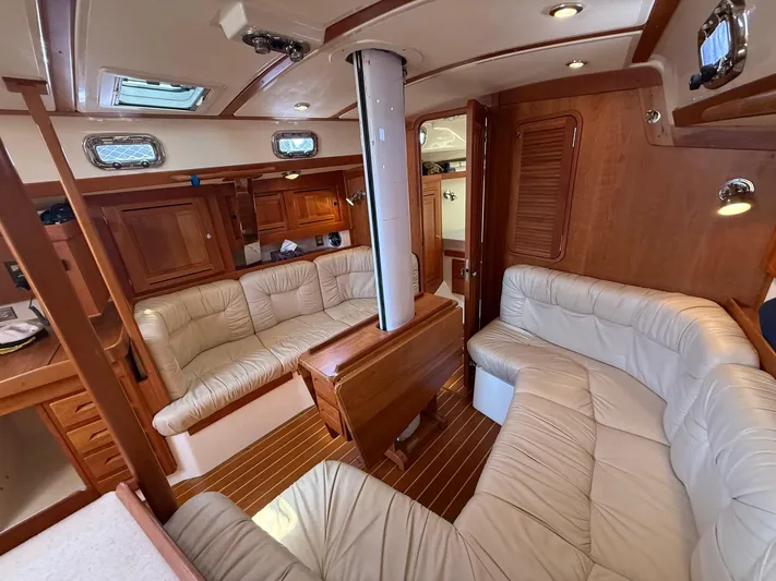 Dawn Treader Yacht Photos Pics Luxurious interior of 2005 Tartan 3700 Keel/Centerboard sailboat with plush seating and wood finish.