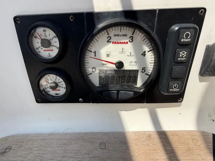 Dawn Treader Yacht Photos Pics Control panel of a 2005 Tartan 3700 Keel/Centerboard with Yanmar gauges and buttons.