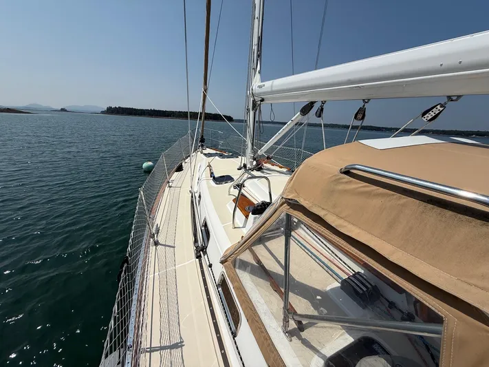 Dawn Treader Yacht Photos Pics Sailboat Tartan 3700 Keel/Centerboard 2005 on calm water, clear sky, scenic view.