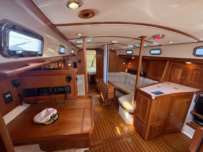 Dawn Treader Yacht Photos Pics Interior of 2005 Tartan 3700 Keel/Centerboard sailboat with wood finish and seating area.