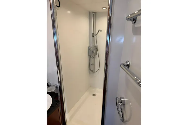  Yacht Photos Pics Shower area in 2006 Sunseeker Predator 82 yacht, featuring sleek chrome fixtures.