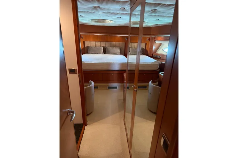  Yacht Photos Pics Luxurious cabin interior of 2006 Sunseeker Predator 82 yacht with plush bedding.