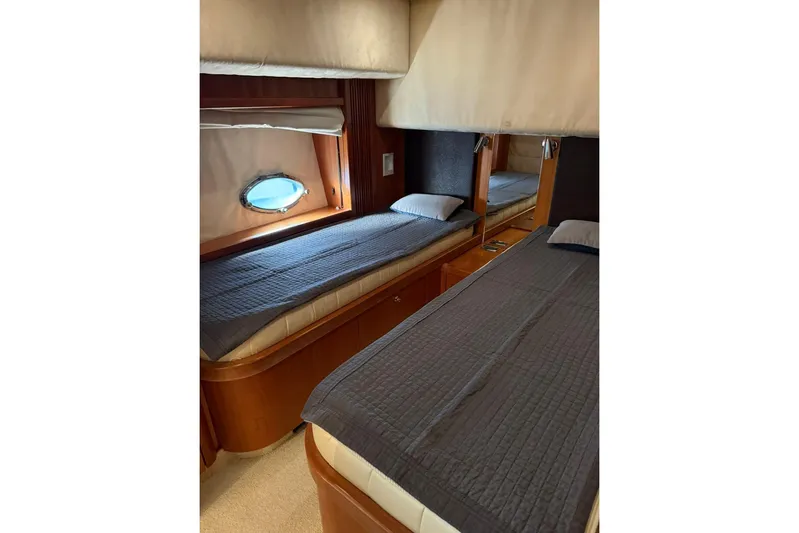  Yacht Photos Pics Luxurious twin cabin interior of 2006 Sunseeker Predator 82 yacht.