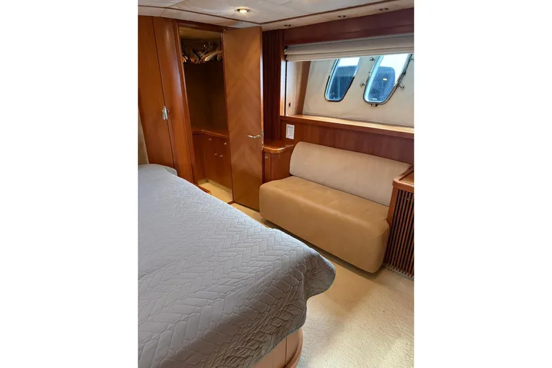  Yacht Photos Pics Luxurious cabin interior of 2006 Sunseeker Predator 82 yacht with bed and seating.