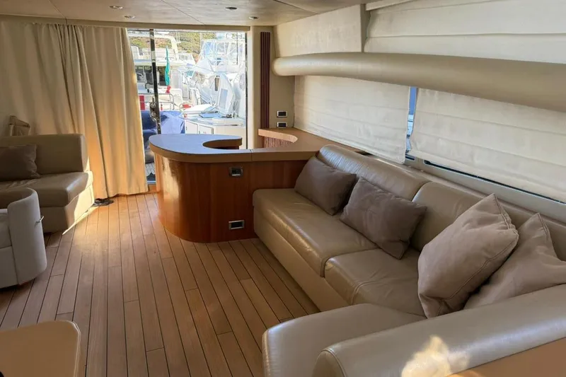  Yacht Photos Pics Luxurious interior of 2006 Sunseeker Predator 82 yacht with elegant seating and wooden flooring.