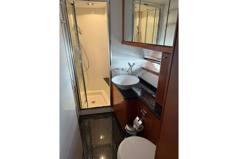  Yacht Photos Pics Luxurious bathroom in 2006 Sunseeker Predator 82 yacht with modern fixtures and shower.