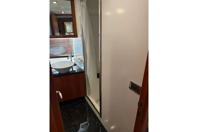  Yacht Photos Pics Luxurious bathroom interior of 2006 Sunseeker Predator 82 yacht with modern fixtures.