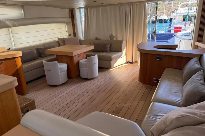  Yacht Photos Pics Luxurious interior of 2006 Sunseeker Predator 82 yacht with elegant seating and wooden accents.