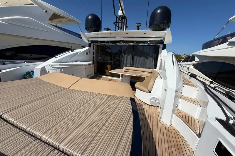  Yacht Photos Pics Luxurious 2006 Sunseeker Predator 82 yacht with spacious deck and seating area.