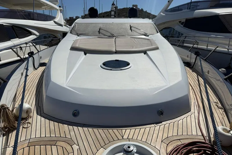  Yacht Photos Pics 2006 Sunseeker Predator 82 yacht with sleek deck design and luxurious sunbathing area.