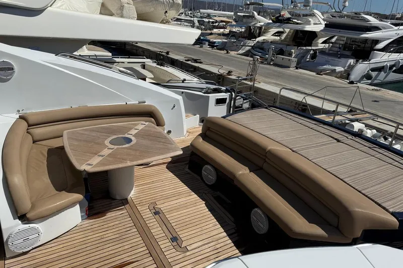  Yacht Photos Pics Luxury Sunseeker Predator 82 yacht deck with seating and table, 2006 model.