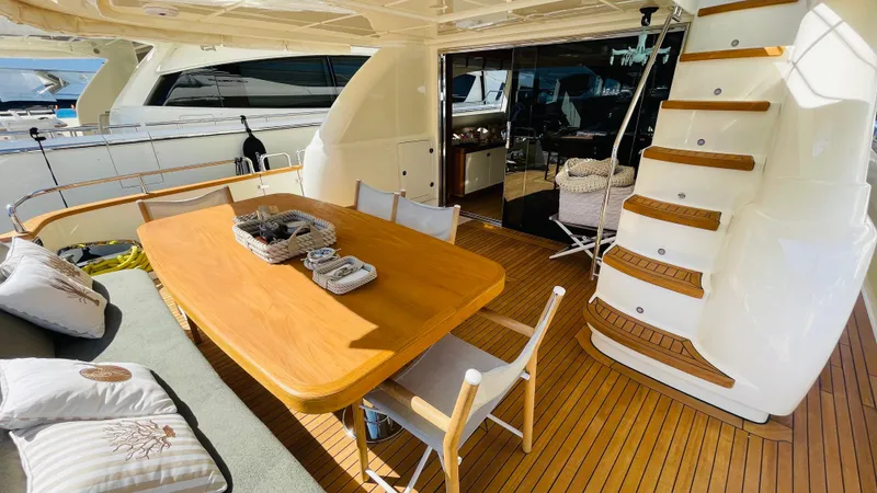  Yacht Photos Pics Luxurious Canados 76 yacht deck with dining area and staircase, 2016 model.