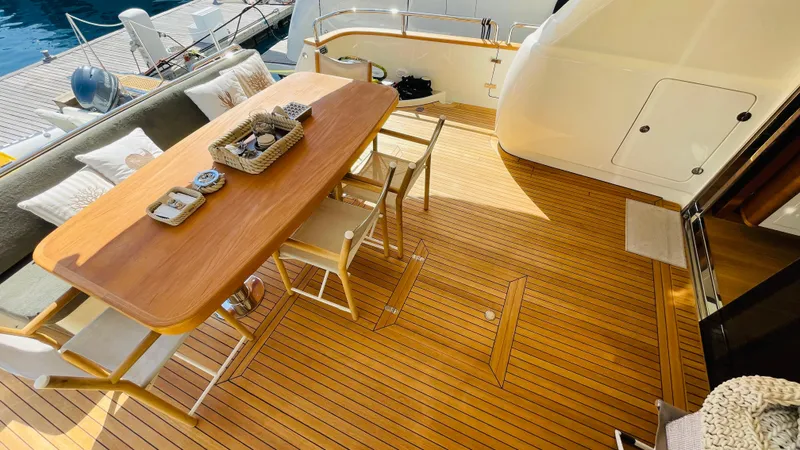  Yacht Photos Pics Luxurious Canados 76 yacht deck with elegant wooden dining area, 2016 model.