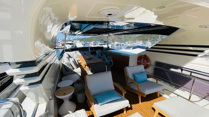  Yacht Photos Pics Luxurious 2016 Canados 76 yacht deck with elegant seating and marina view.