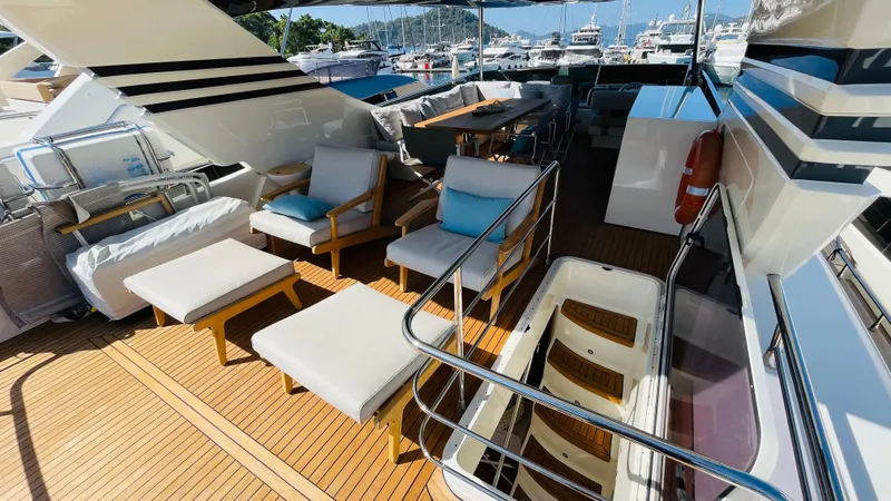  Yacht Photos Pics Luxurious 2016 Canados 76 yacht deck with elegant seating and dining area.