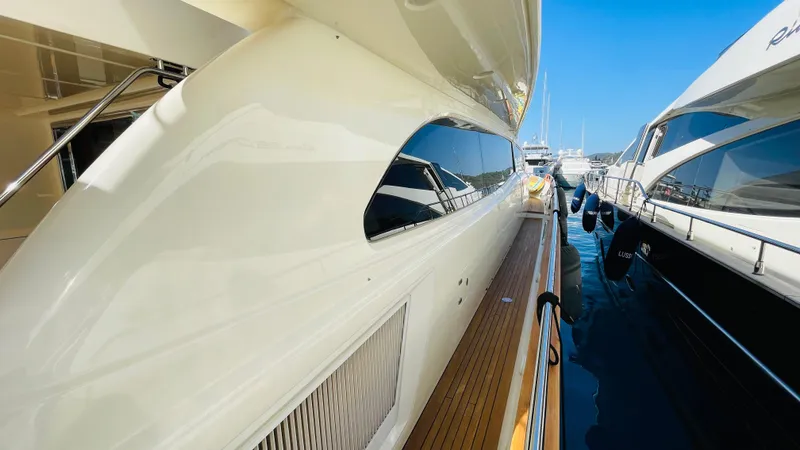  Yacht Photos Pics 2016 Canados 76 yacht docked, showcasing sleek design and polished wood deck.