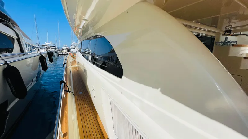  Yacht Photos Pics Luxurious 2016 Canados 76 yacht docked, showcasing sleek design and polished deck.