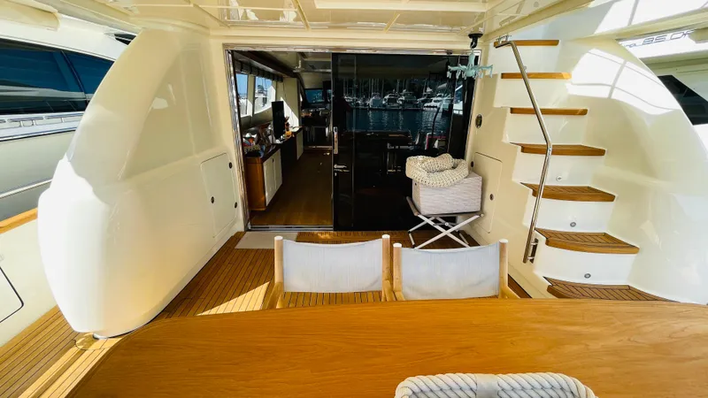  Yacht Photos Pics Luxurious 2016 Canados 76 yacht interior with wooden deck and elegant staircase.