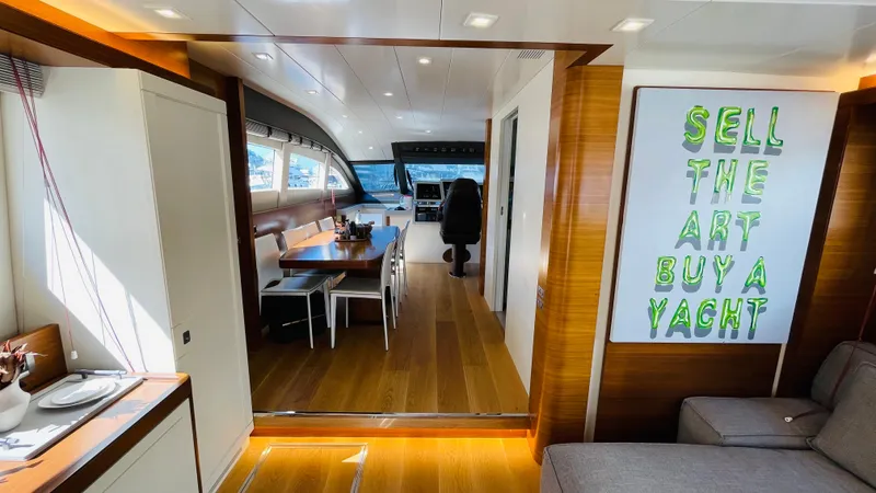  Yacht Photos Pics Luxurious interior of 2016 Canados 76 yacht with modern dining area and art decor.