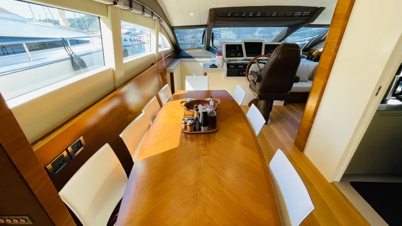  Yacht Photos Pics Luxurious interior of 2016 Canados 76 yacht with elegant dining area and helm station.