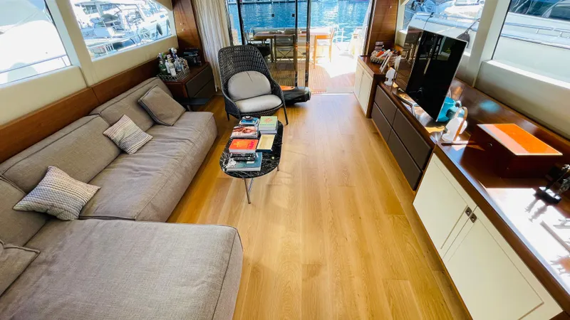  Yacht Photos Pics Luxurious interior of 2016 Canados 76 yacht with elegant furnishings and wooden flooring.