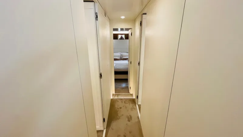  Yacht Photos Pics Hallway leading to bedroom in 2016 Canados 76 yacht, featuring sleek, modern design.