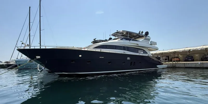  Yacht Photos Pics Luxury 2016 Canados 76 yacht docked in a marina under clear skies.