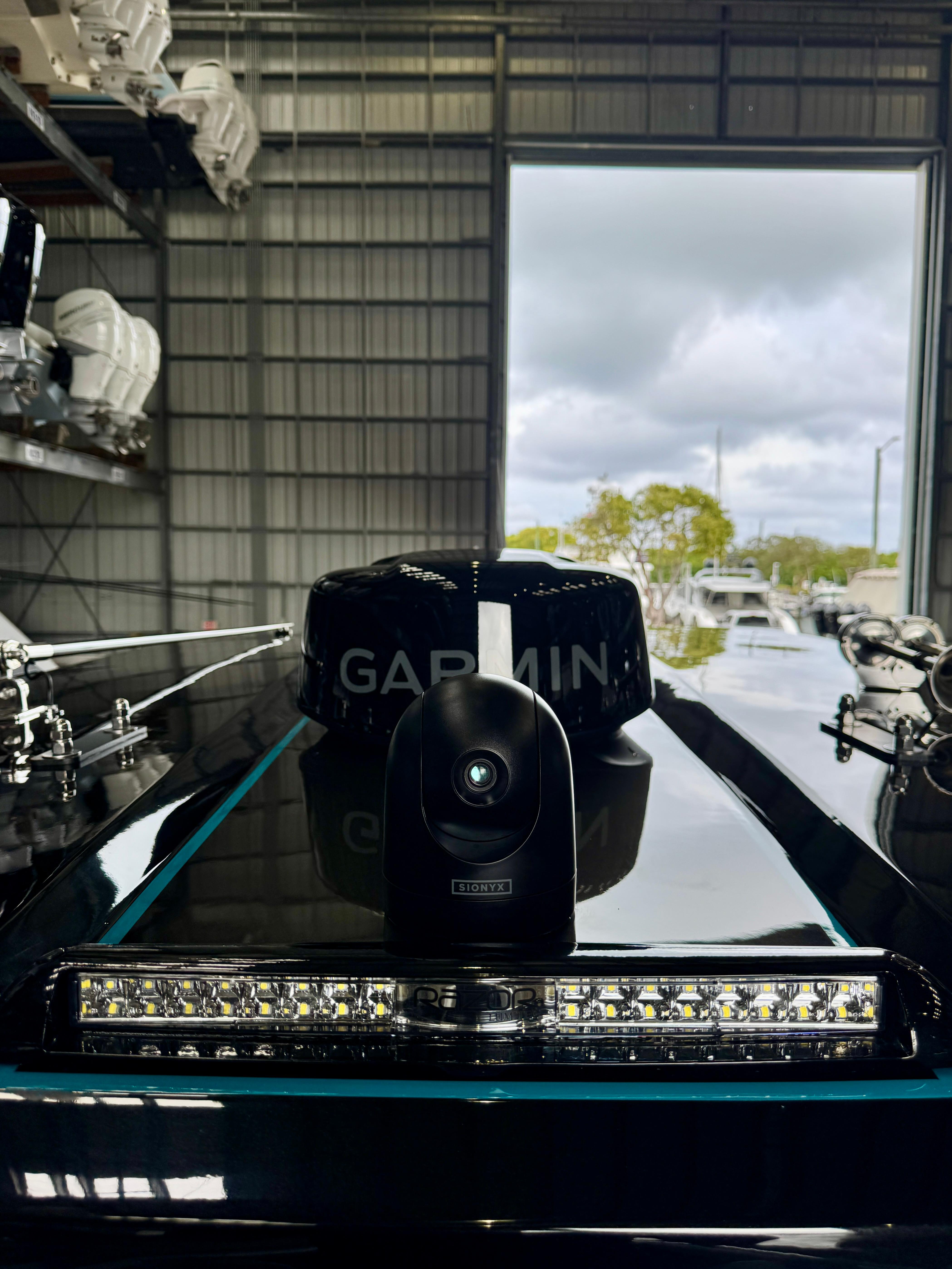 2024 AMP 333 boat with Garmin equipment in a warehouse setting.