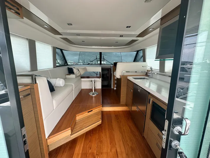 Finally Yacht Photos Pics Luxurious interior of 2021 Tiara Yachts F44 Flybridge with modern furnishings and sleek design.