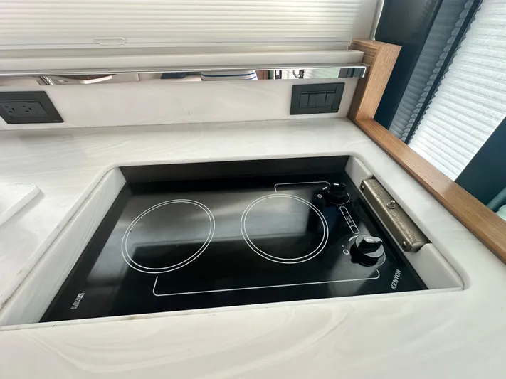 Finally Yacht Photos Pics Modern stovetop in 2021 Tiara Yachts F44 Flybridge kitchen area.