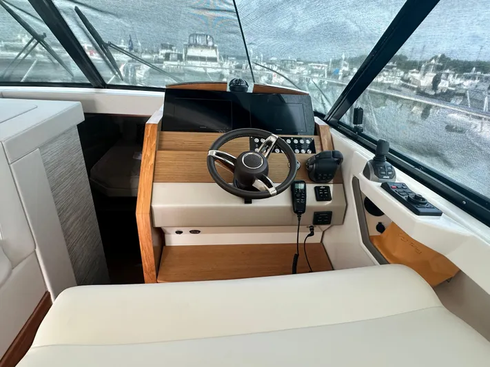 Finally Yacht Photos Pics 2021 Tiara Yachts F44 Flybridge helm with modern controls and panoramic view.