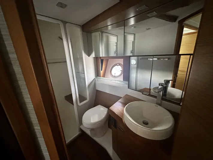 Finally Yacht Photos Pics Luxurious 2021 Tiara Yachts F44 Flybridge bathroom with modern fixtures and elegant design.