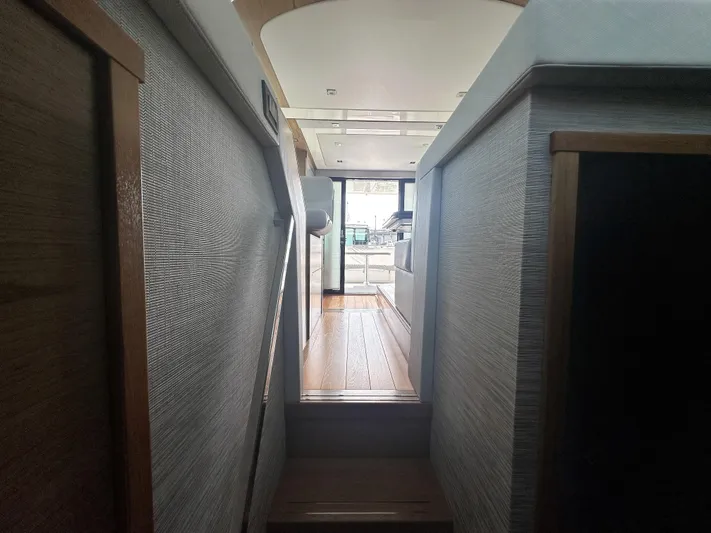 Finally Yacht Photos Pics Interior view of 2021 Tiara Yachts F44 Flybridge, showcasing modern design and wood accents.