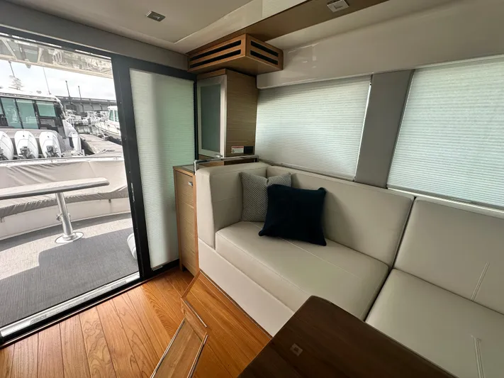 Finally Yacht Photos Pics Interior of 2021 Tiara Yachts F44 Flybridge with modern seating and outdoor view.
