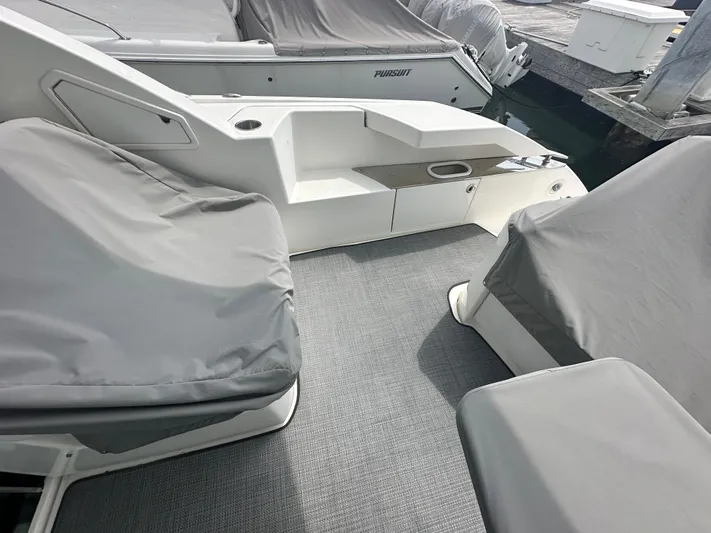 Finally Yacht Photos Pics 2021 Tiara Yachts F44 Flybridge deck with covered seating and modern design.