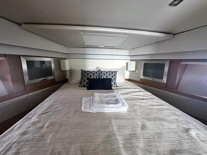 Finally Yacht Photos Pics Luxurious 2021 Tiara Yachts F44 Flybridge cabin with elegant bedding and modern design.