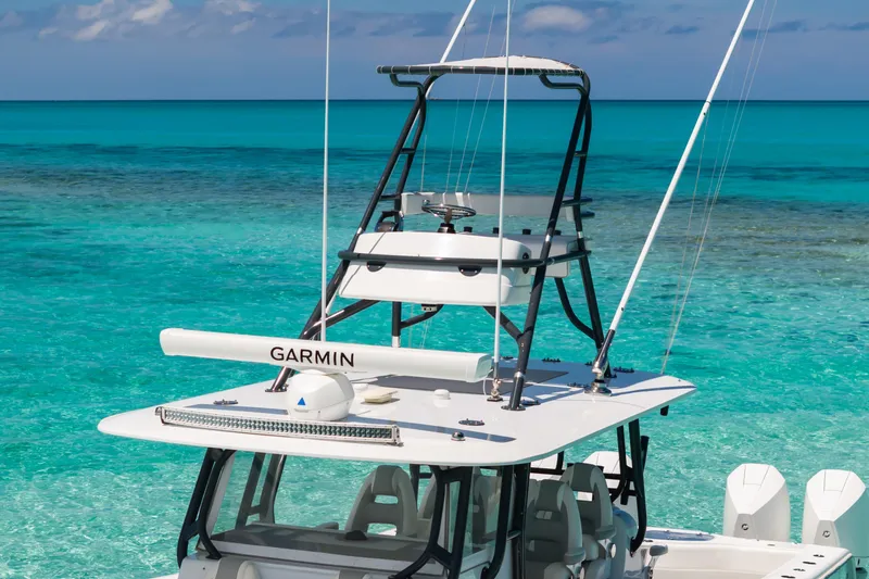 Reel Deal Yacht Photos Pics 2023 Freeman 42 LR boat with Garmin equipment on turquoise ocean water.